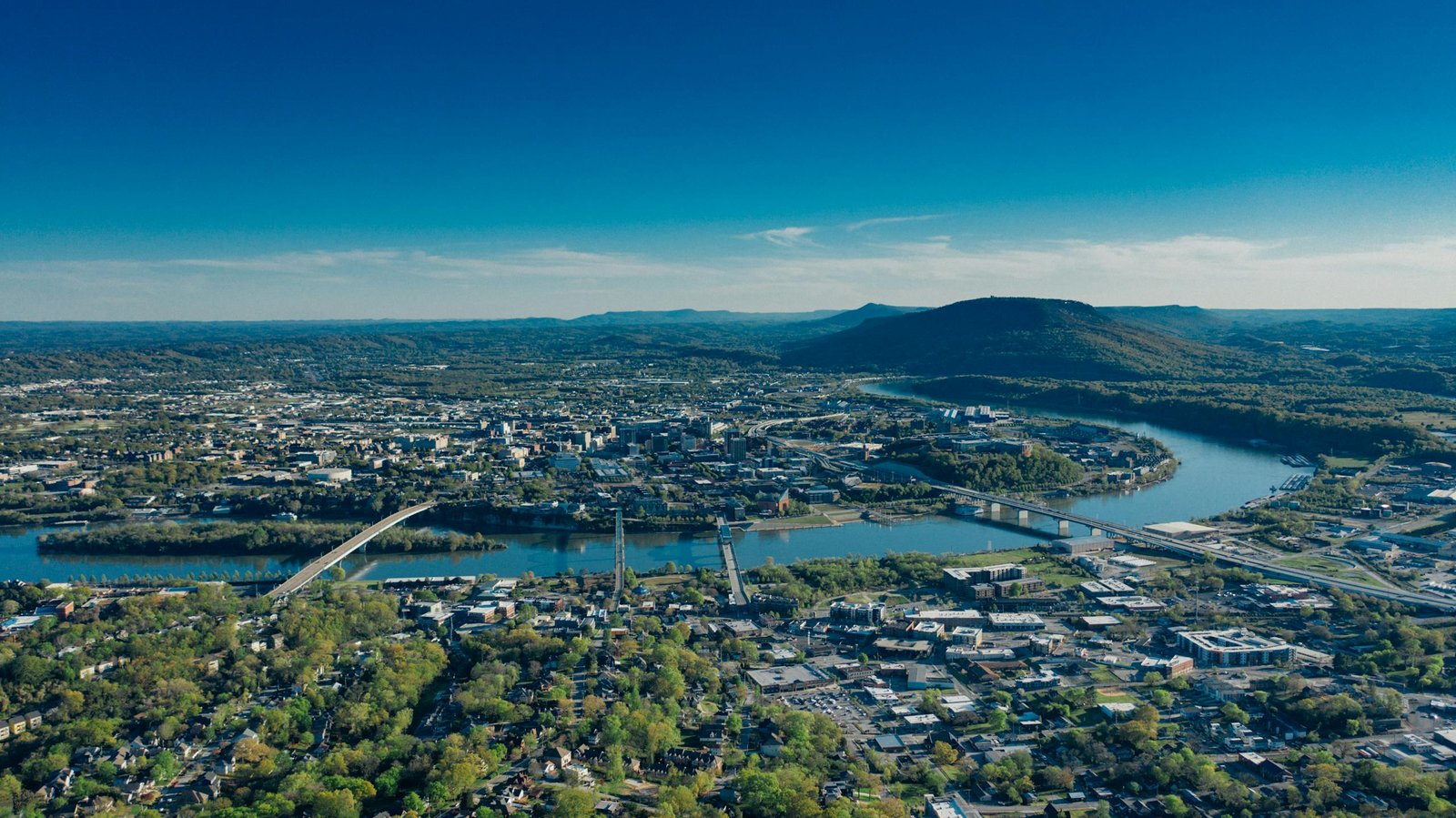Stunning aerial view of Chattanooga, TN, showcasing the Tennessee River and surrounding landscape.
