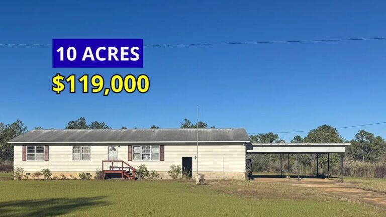 Exterior view of a renovated rural home on 10 acres for sale at $119,000 in Lowland, North Carolina