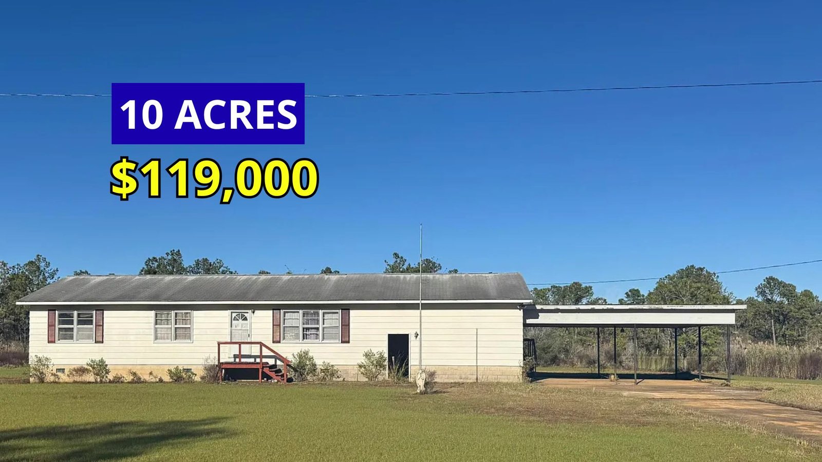 Exterior view of a renovated rural home on 10 acres for sale at $119,000 in Lowland, North Carolina