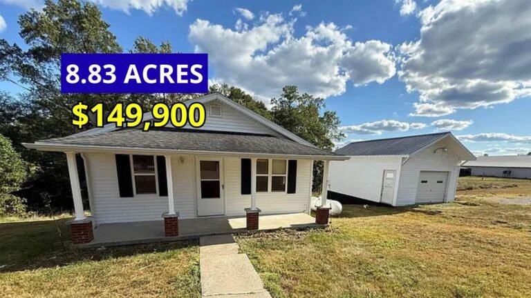 Exterior view of a rural farmhouse on 8.83 acres for sale at $149,000 in Elk Horn, Kentucky