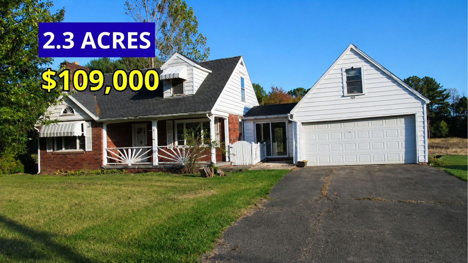 Exterior view of a 1954 Cape Cod home on 2.3 acres with an attached two-car garage and walk-out basement for sale at $109,900 near Oil City, Pennsylvania