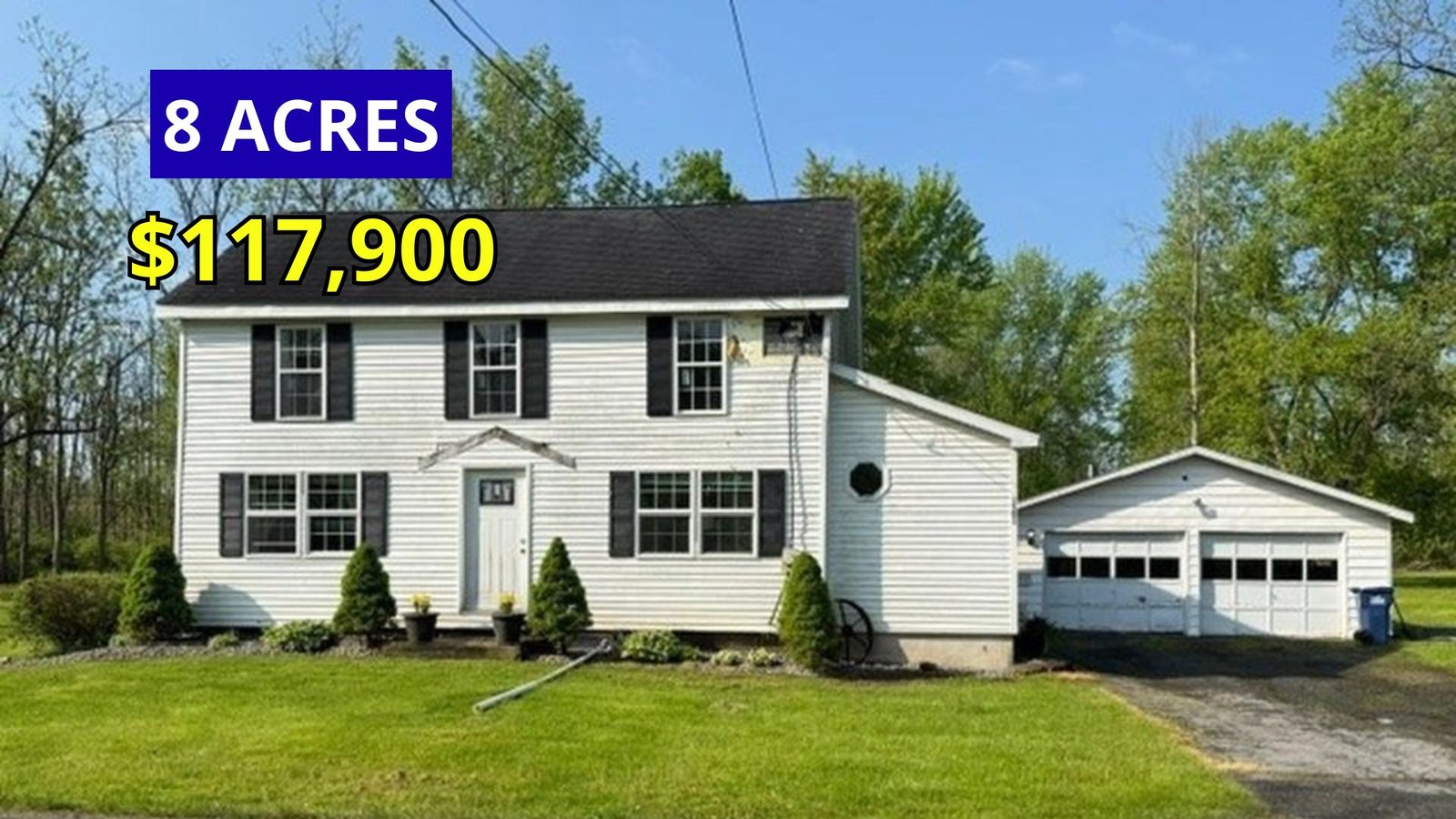 Exterior view of a 1880 Colonial farmhouse on 8 acres for sale at $117,900 in Oneida, New York