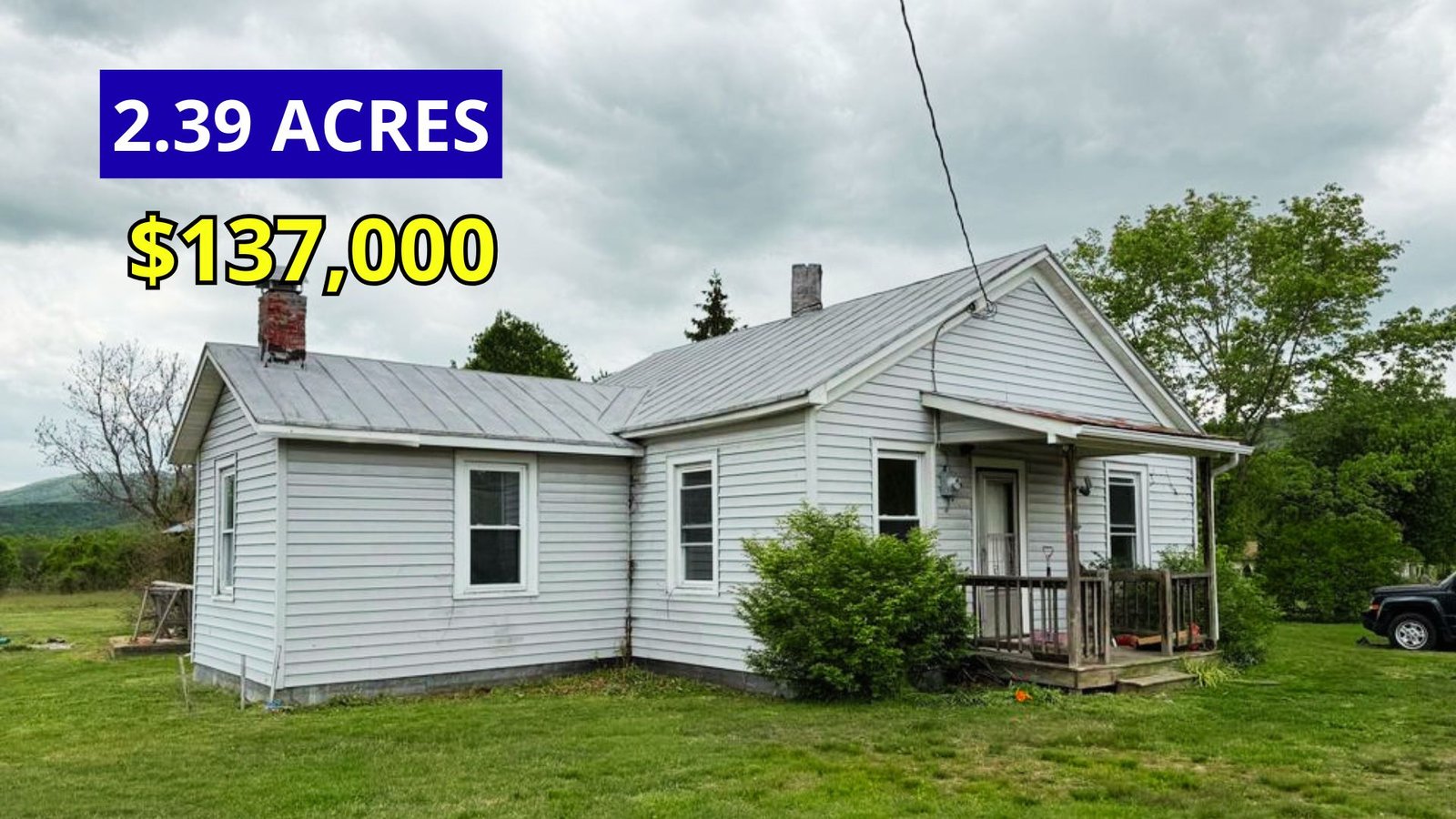 Exterior view of a 1913 home on 2.39 acres with stunning mountain views for sale at $137,000 in Clifton Forge, Virginia