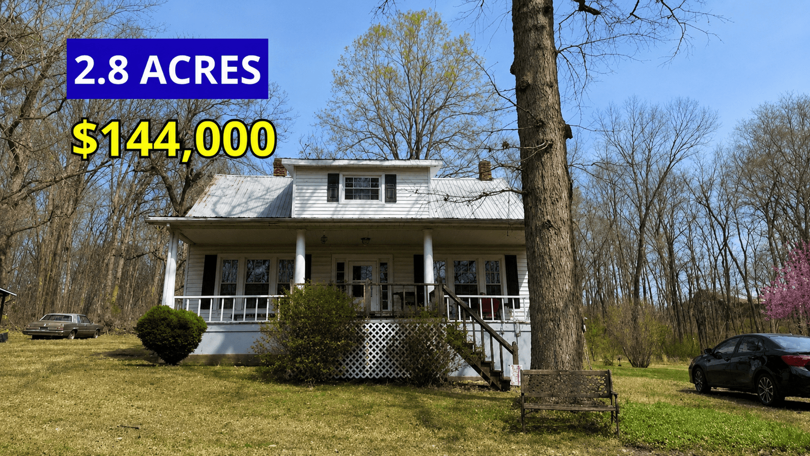 Exterior view of a 1920 farmhouse with rocking chair porch on 2.8 acres for sale at $144,000 in Long Island, Virginia