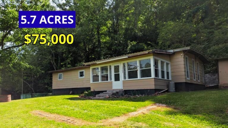 Exterior view of a four-bedroom home on 5.7 acres at the base of a mountain across from Piney River for sale at $75,000 in Spring City, Tennessee