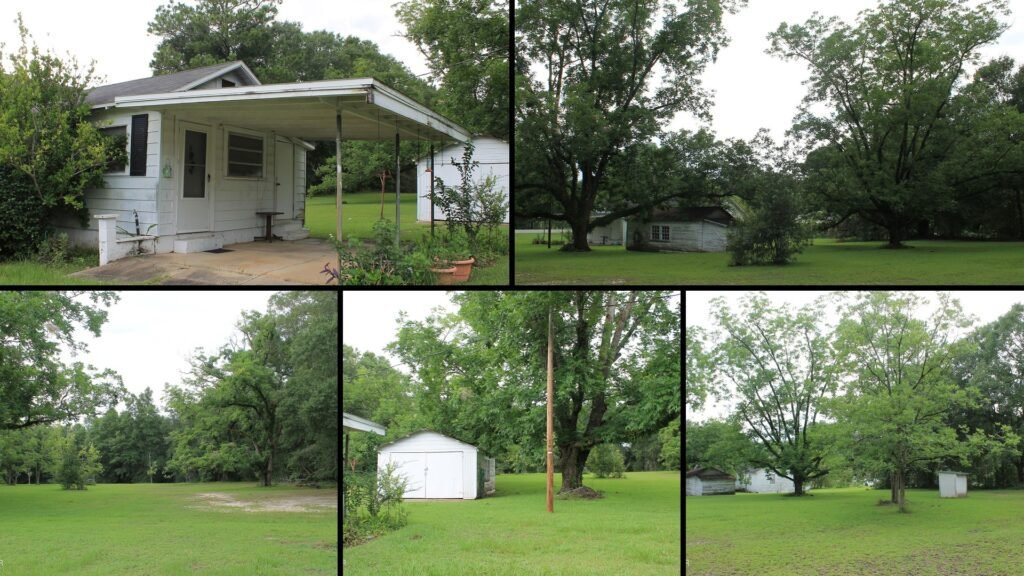 Exterior and land of a rural property for sale in Graceville Florida — 2 level acres with mature pecan trees, a metal shed and a covered carport