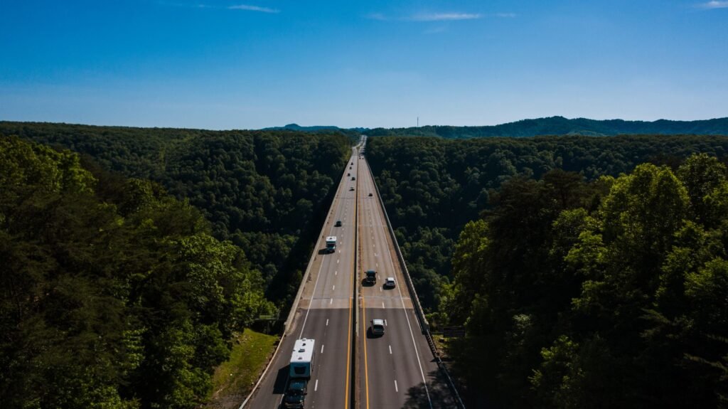 Four-lane highway cutting through green forest near Lansing, Fayette County, West Virginia