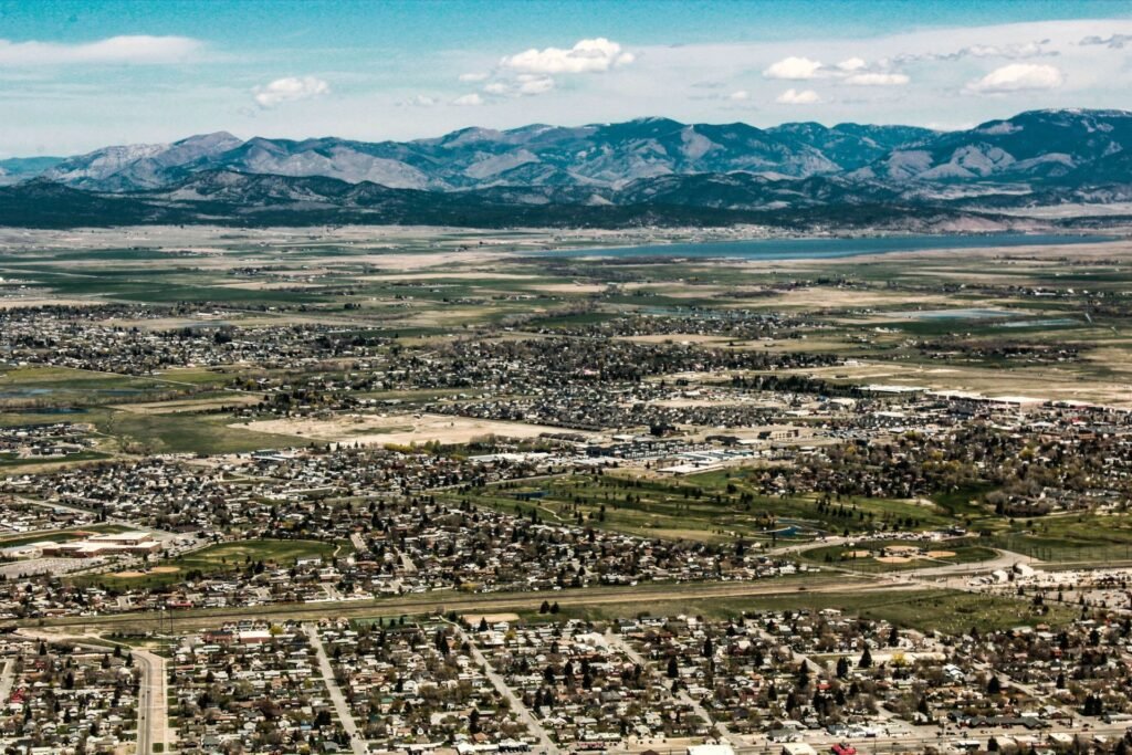 Aerial view of Helena, Montana, with the town, surrounding fields and mountains