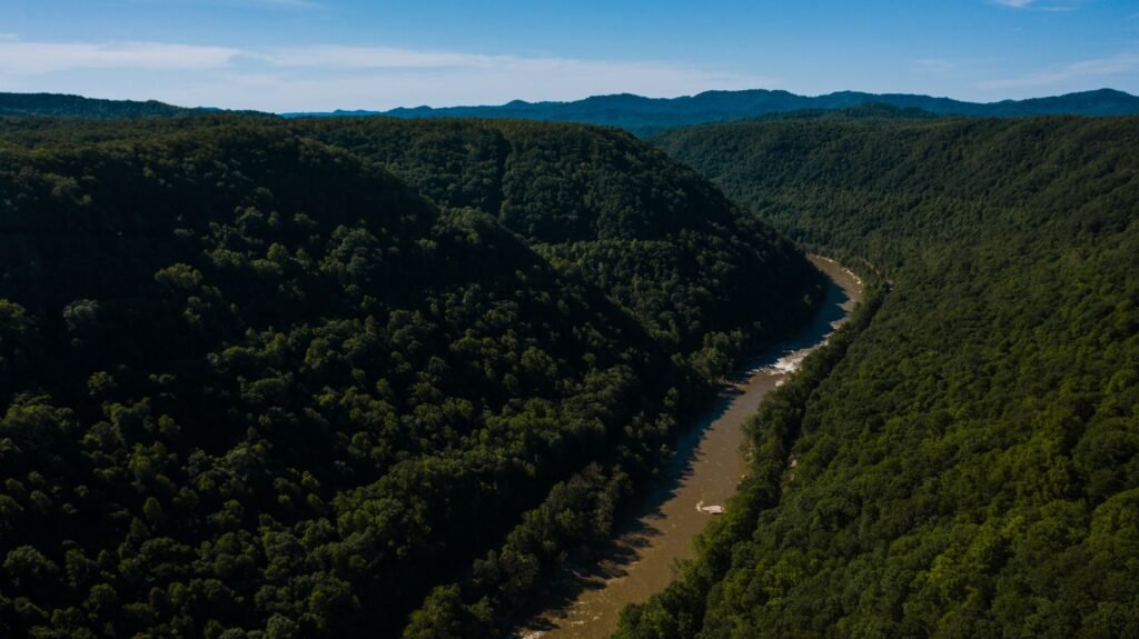 River running through a steep wooded valley near Victor, Fayette County, West Virginia
