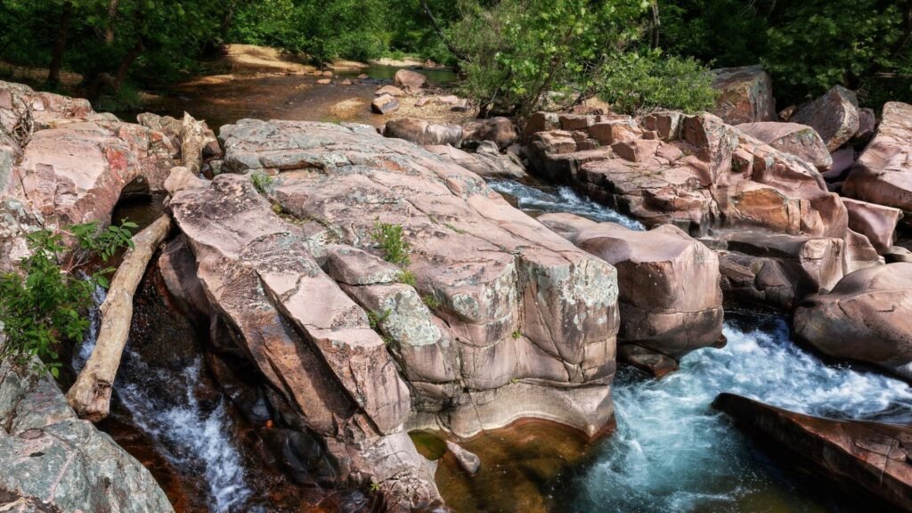 Pink granite boulders and a fast stream near Fredericktown in Madison County, Missouri
