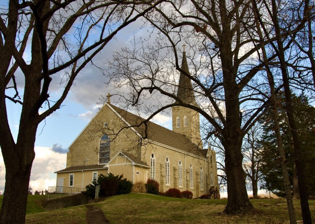 Stone church and bare trees in autumn in the village of Starkenburg, Missouri